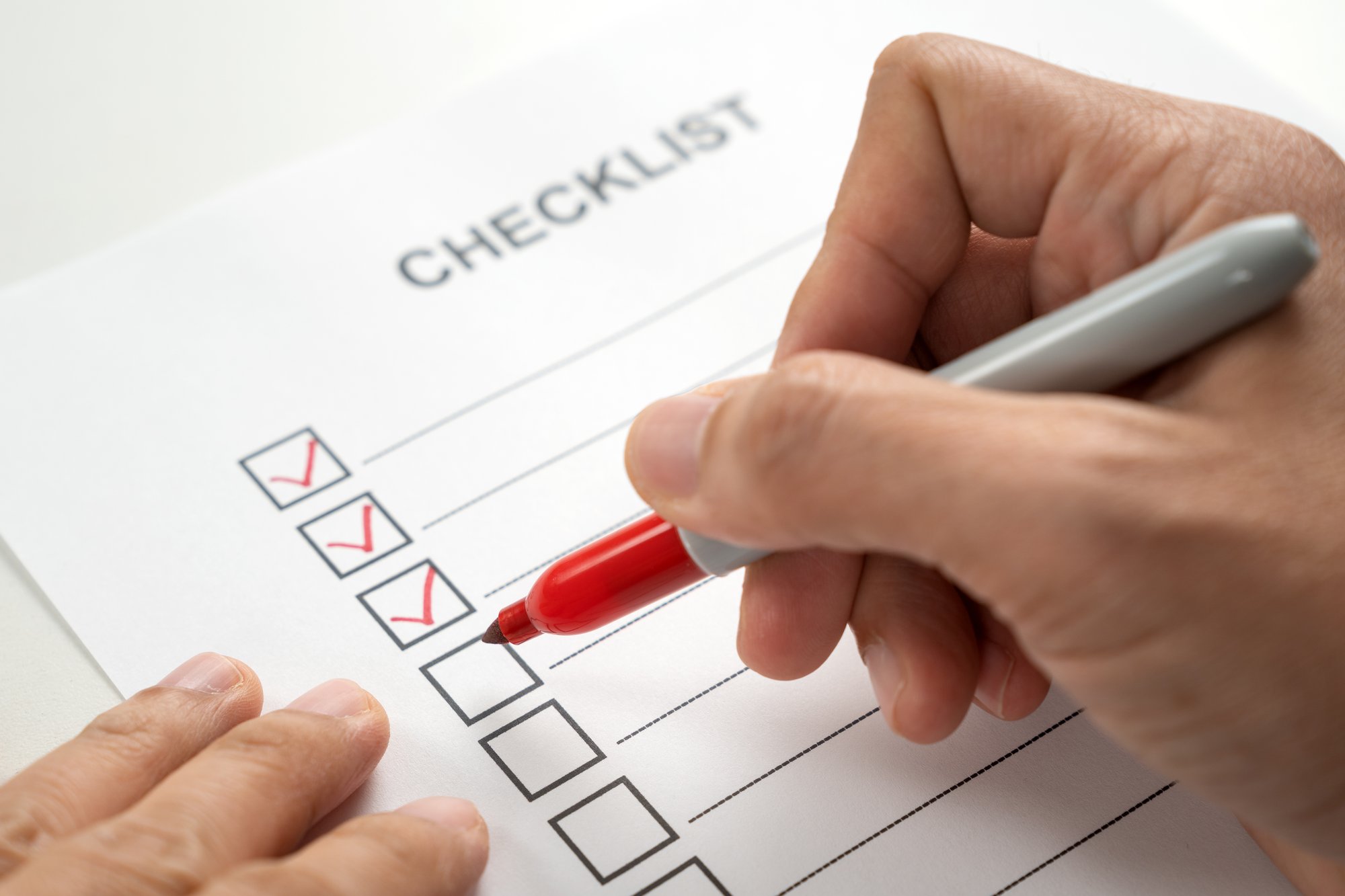 hand-with-red-marker-pen-marking-on-checklist-box-2024-12-13-18-33-26-utc